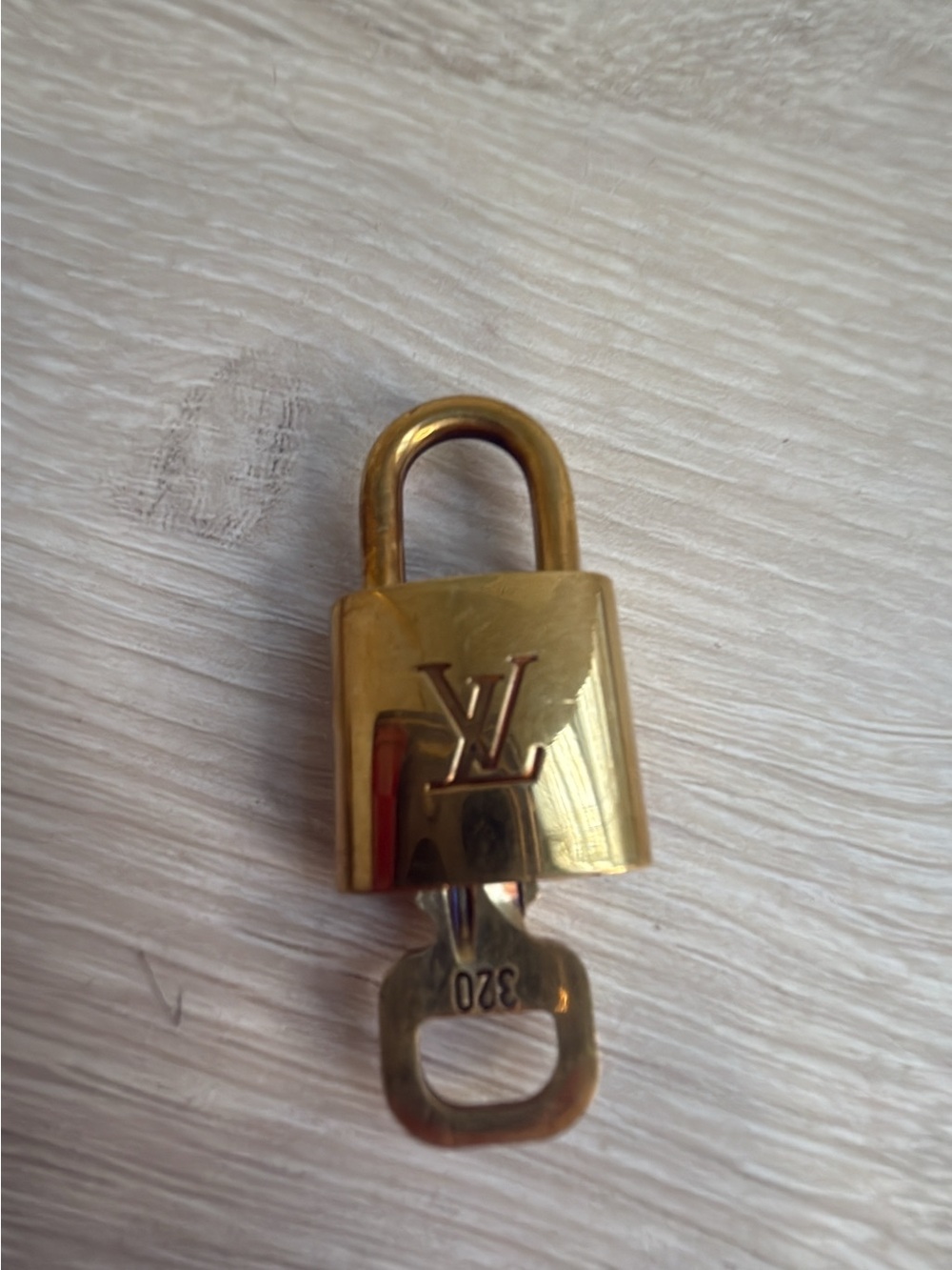 Very pretty authentic Louis Vuitton brass lock and key